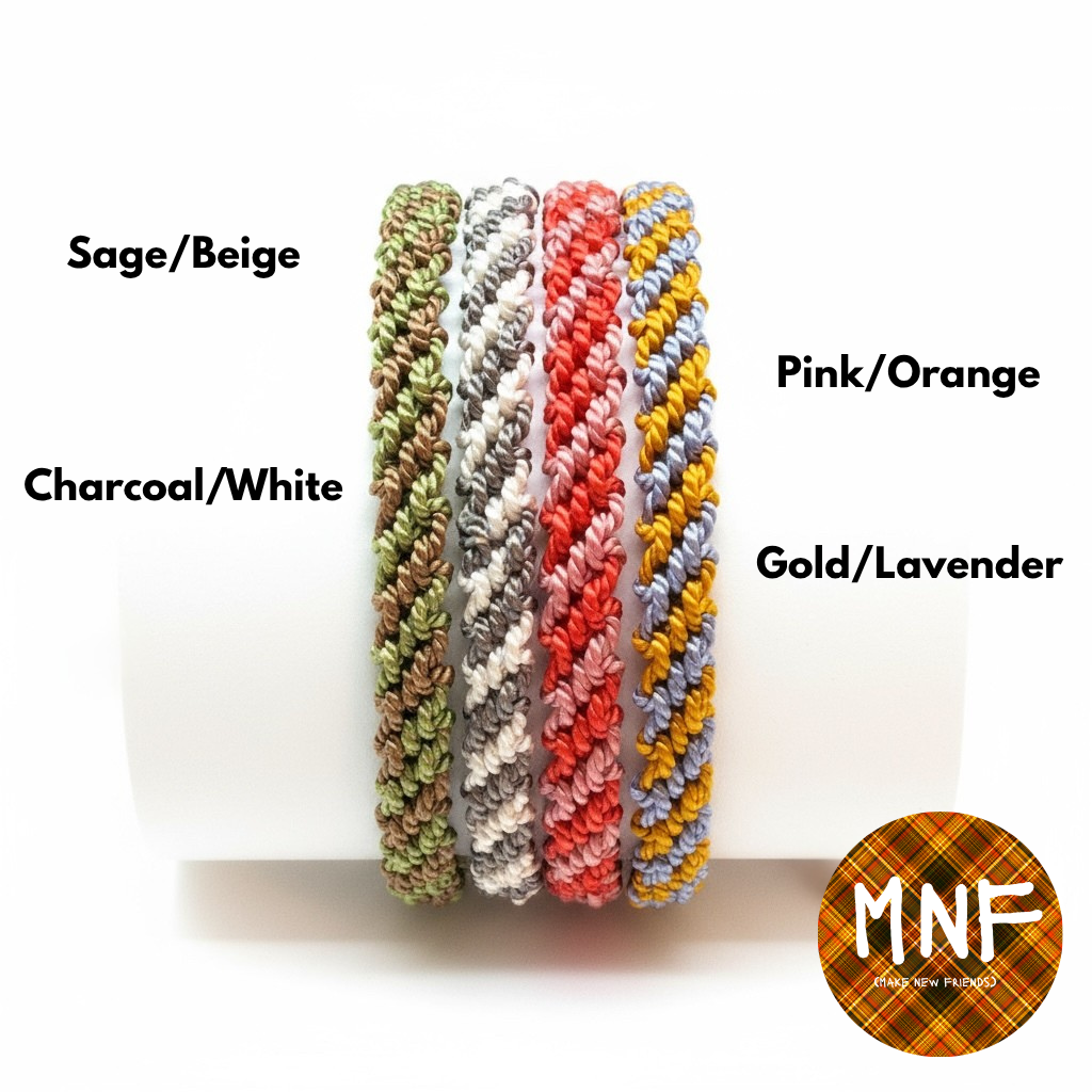 Set of five braided friendship bracelets in different colors with labels on a white background, featuring the brand 'MNF'.